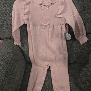 Soft Pink Knit Baby One-Piece with Ruffle & Bow Details